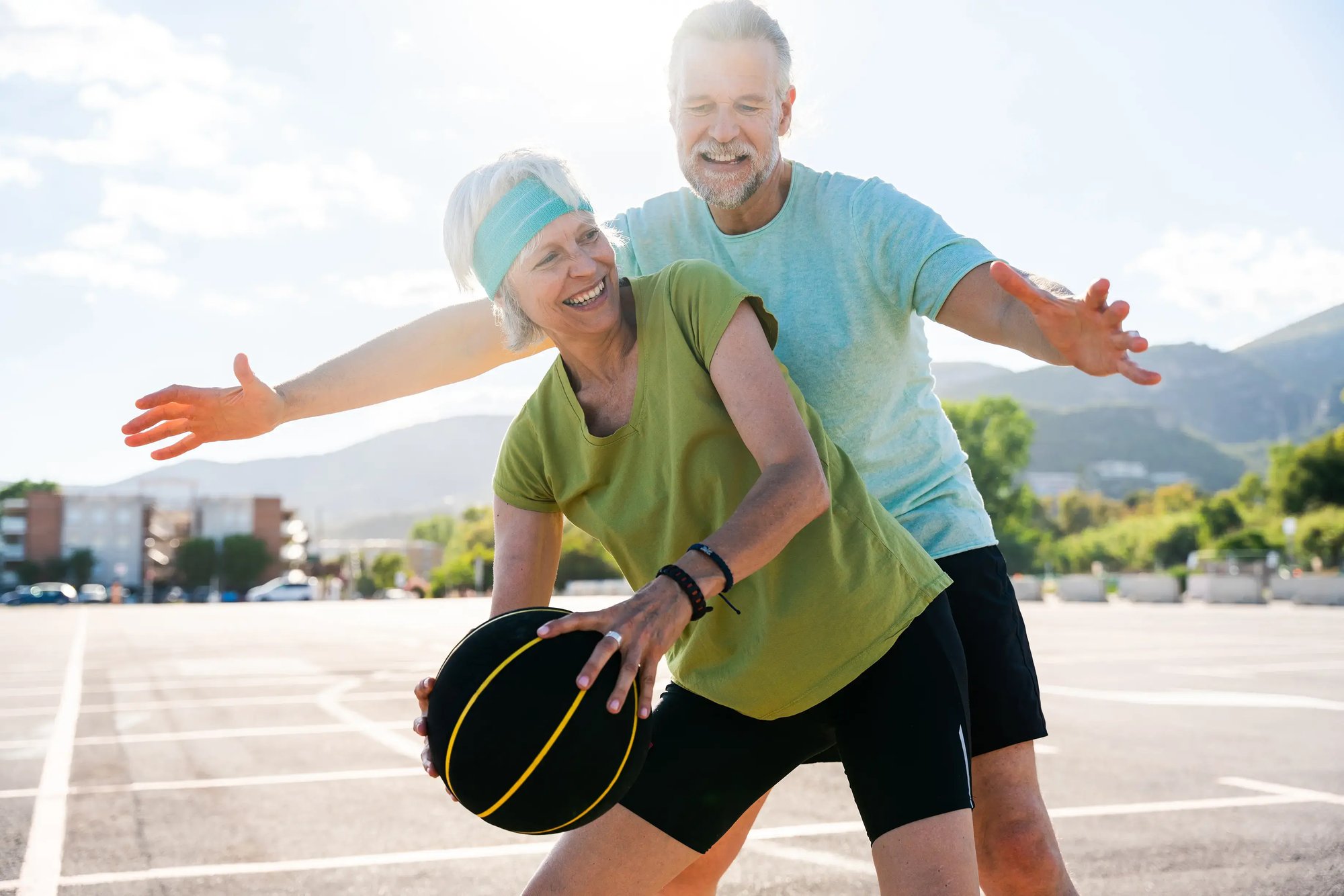 longevity_active-health-senior-couple-playing-basketball