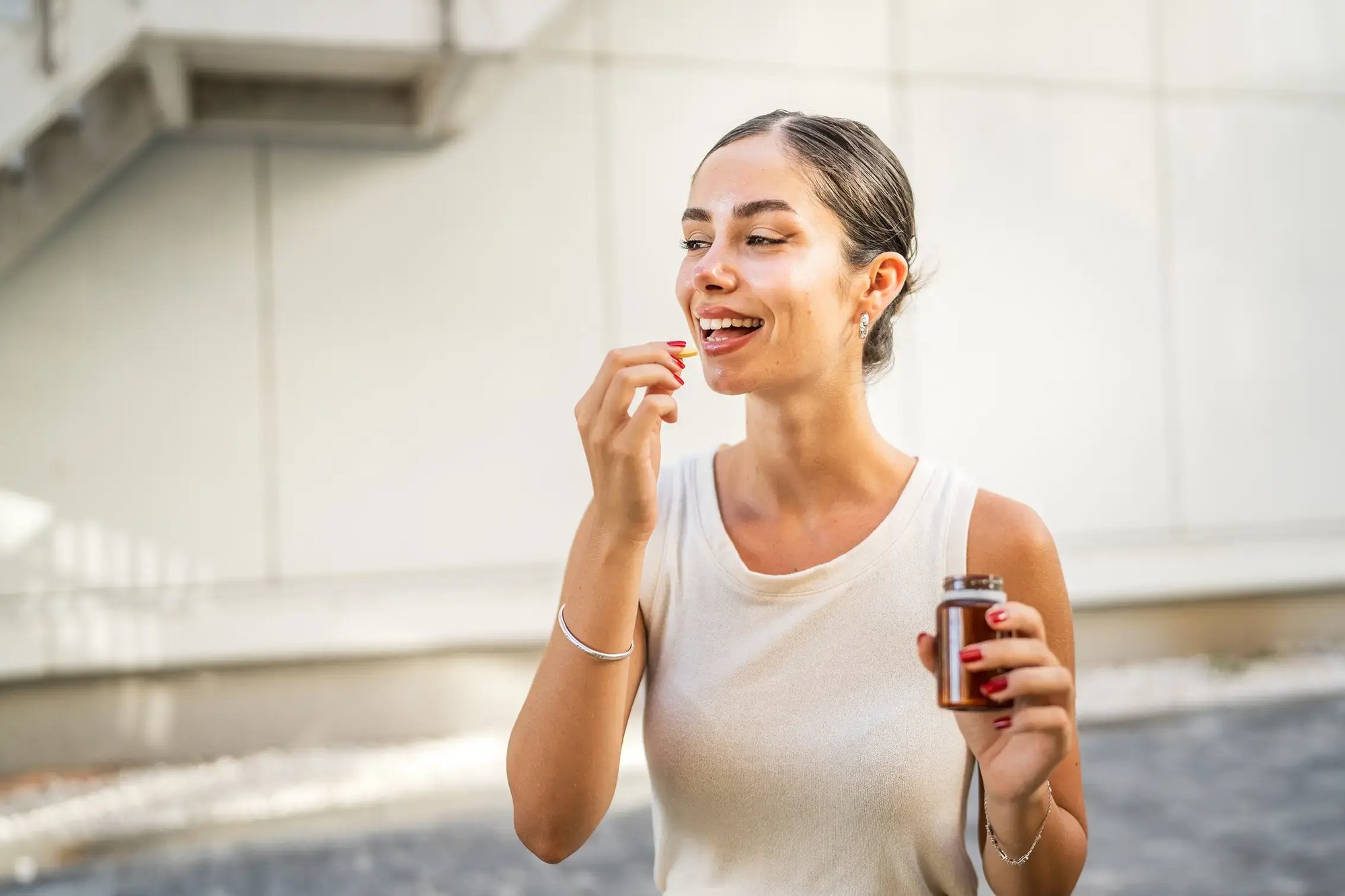 longevity_happy-woman-taking-medication-pharmaceutical