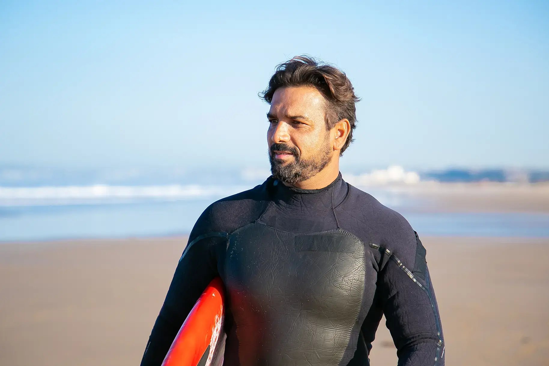 men-hormone-health_middle-aged-man-surfer-on-beach