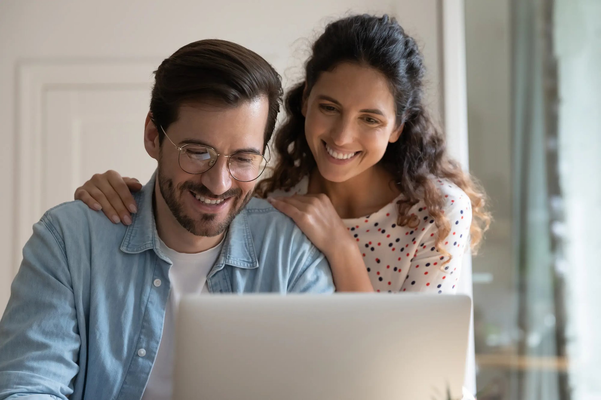 telehealth_online-consultation-happy-couple-video-call-using-laptop